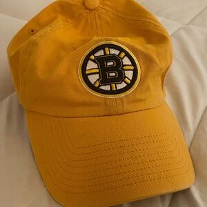 ‘47 brand Boston Bruins Cap. Yellow, black, white logo with an adjustable back